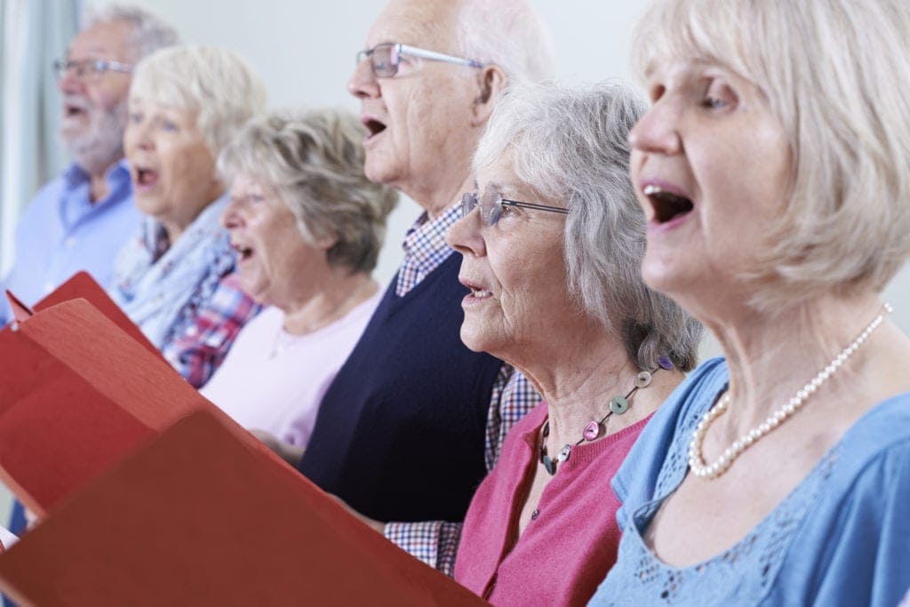 Group of seniors singing in a choir