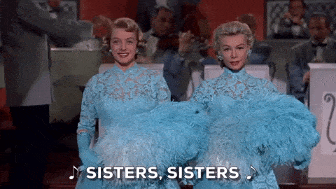 A gif of two women say sister, sister