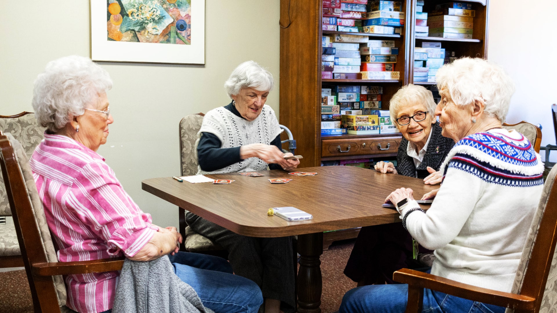 Game night at the Terrace Retirement Community. Four senior ladies playing a game of cards.
