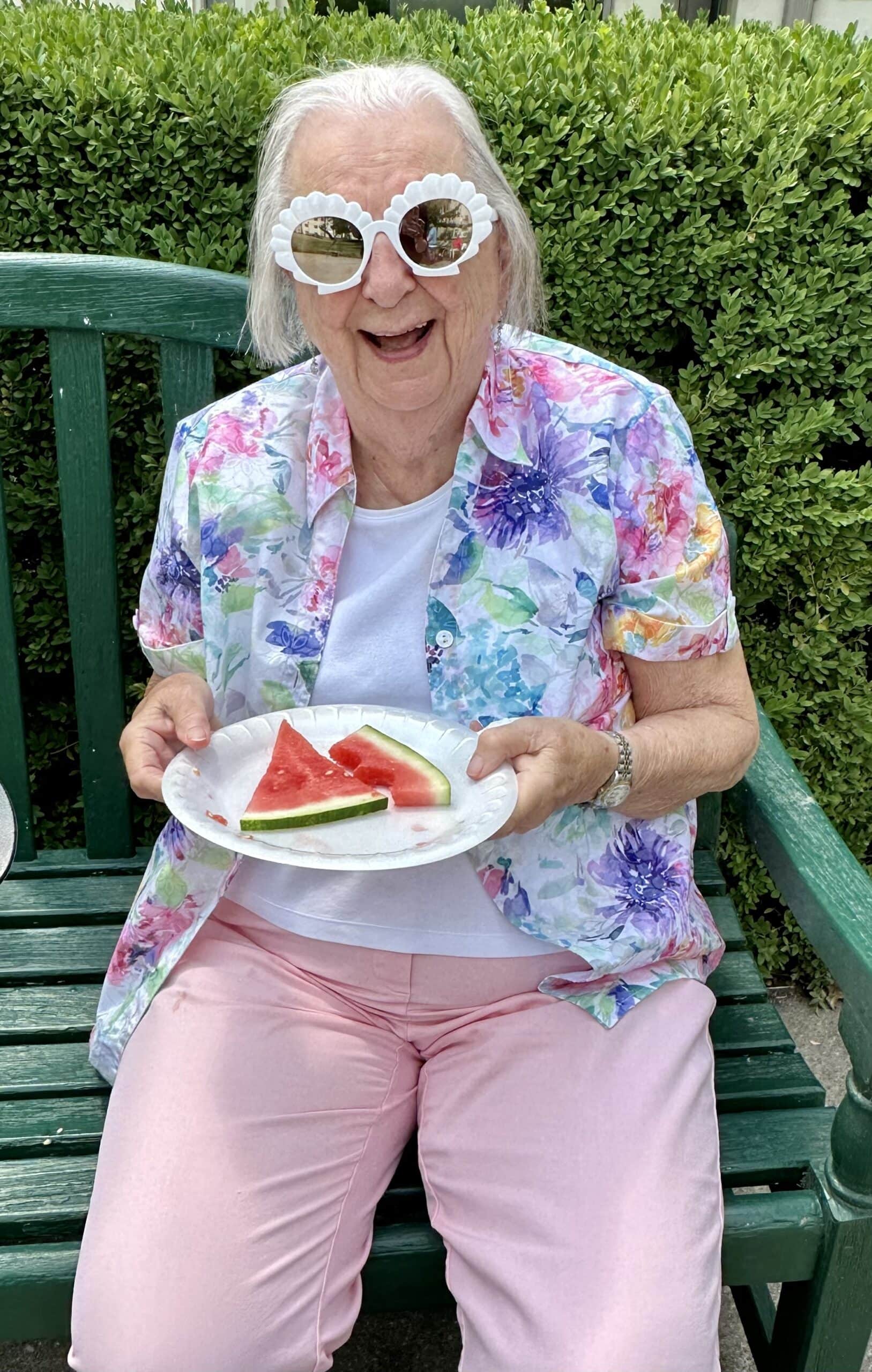 senior resident at the Terrace enjoying watermelon